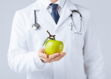 Male Doctor With Green Apple