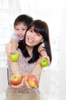 © szeyuen - Healthy eating concept. mother and son holding apples