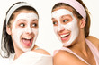 © CandyBox Images - Cheerful girls having facial mask and laughing