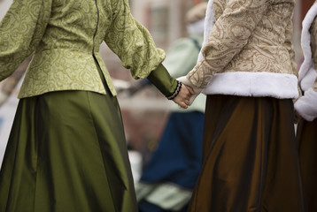 hands of women in traditional russian clothing