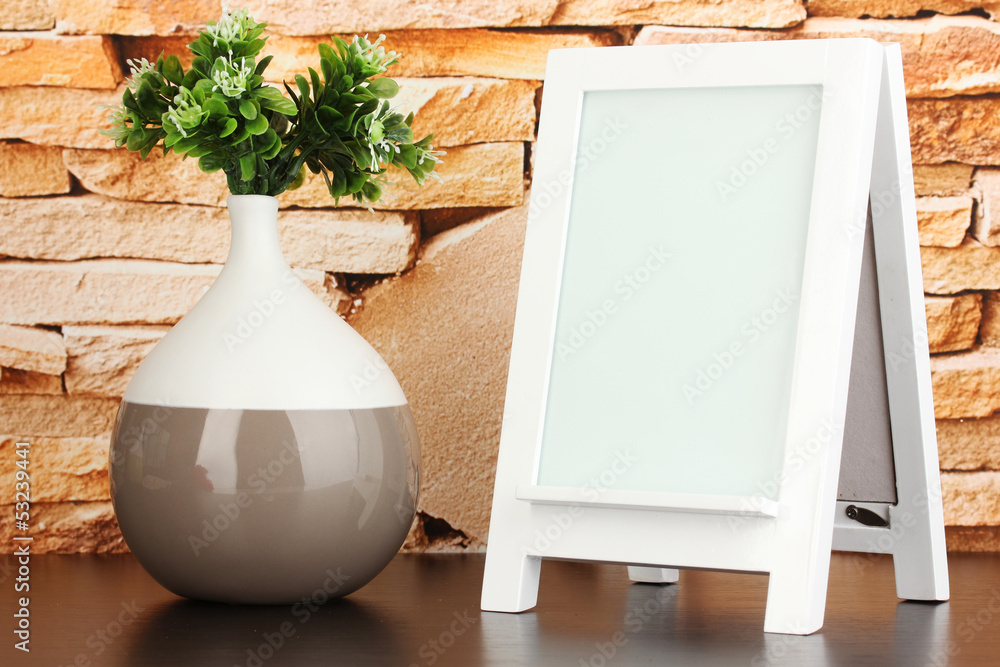White photo frame for home decoration on stone wall background