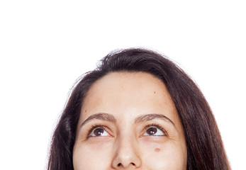 Close-up of a young woman looking up. Isolated on white backgrou