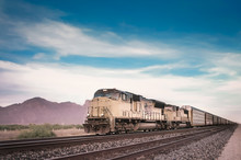 Freight Train In Arizona Desert Landscape