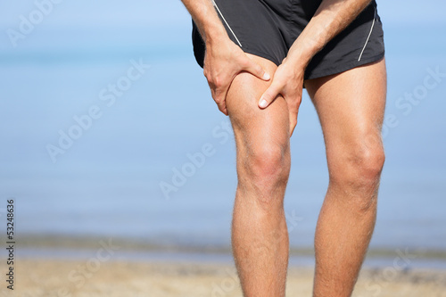 Cuadros en Lienzo Muscle injury. Man with sprain thigh muscles
