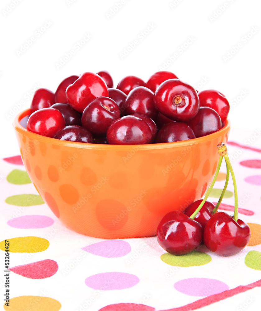 Cherry berries in bowl isolated on white