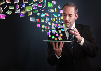 Tablet PC with cloud of application icons