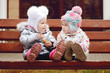 baby friends on bench