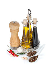 Wall Mural - Olive oil, vinegar bottles, pepper shaker and spices