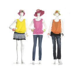 Wall Mural - Full female clothes in jeans with hat on three mannequin