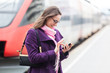 © william87 - Young Business Woman at Station