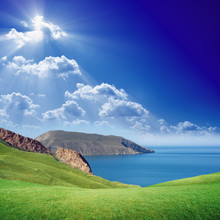 Green Hills, Blue Sea And Sky