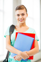 Canvas Print - student girl with school bag and notebooks