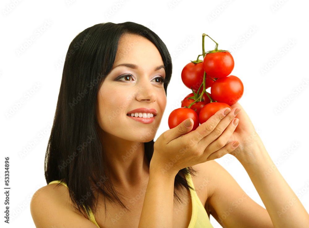 Girl with fresh tomatoes isolated on white