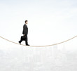 © peshkova - man walking on a rope