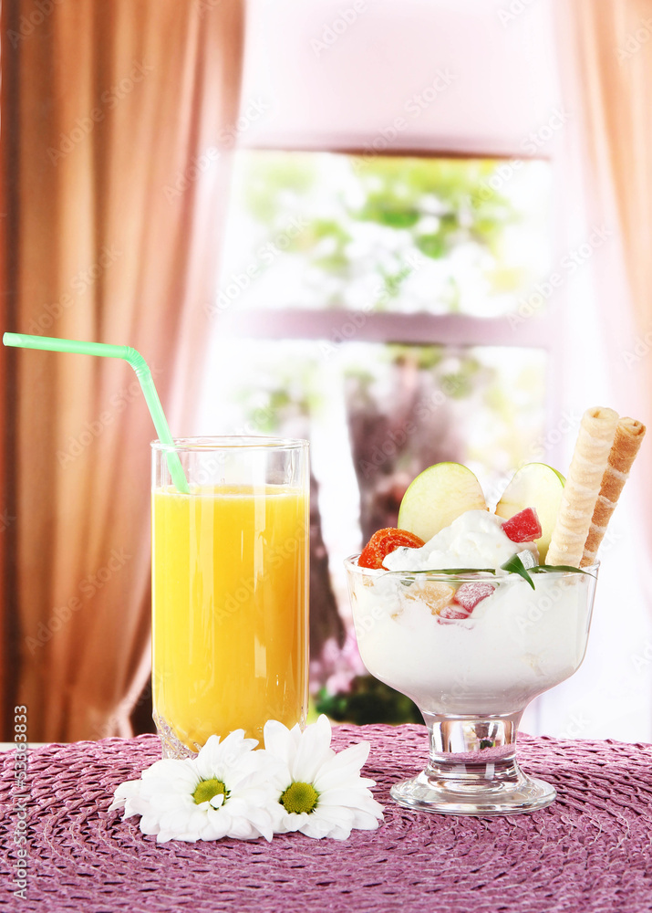 Ice cream with wafer sticks on napkin on window background