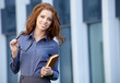 © ZoomTeam - Young happy women or student on the property business background