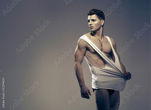 Foto-Banner aus PVC - Sexy fashion portrait of a hot male model (von Aarrttuurr)