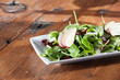 Fresh organic spinach artisan salad with pears and cranberries