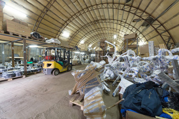 storage area with gym equipment sport trainers stacked