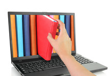 Laptop Computer With Colored Books.