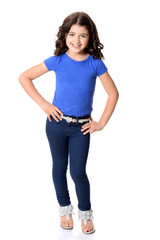 little girl wearing blue jeans with hands on hips