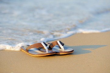 Wall Mural - Flip flops on a sandy