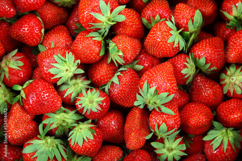 Naklejka - mata magnetyczna na lodówkę Fresh strawberry fruit as a backdrop.