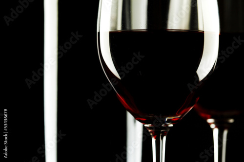 Fototapeta na wymiar Red Wine Glass silhouette Black Background