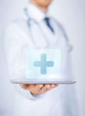 male doctor holding tablet pc with medical app