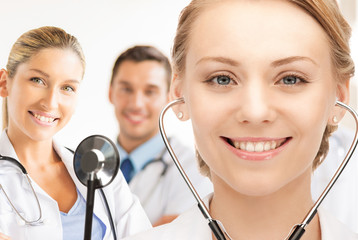 Poster - attractive female doctor with stethoscope