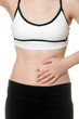 © joesayhello - woman stomach ache in Sports wear isolated on white background