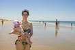 © FotoAndalucia - mother and son at the beach.The baby is enjoying it.