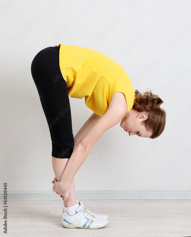 Portrait of beautiful young woman exercises