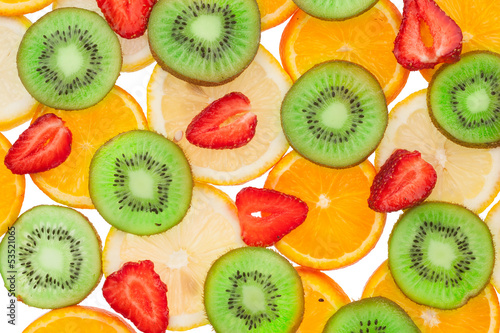 Obraz w ramie Sliced ​​orange, lemon, strawberry and kiwi