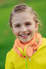 Wall Mural - Young girl with headphones