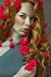 beautiful red-haired girl with flowers