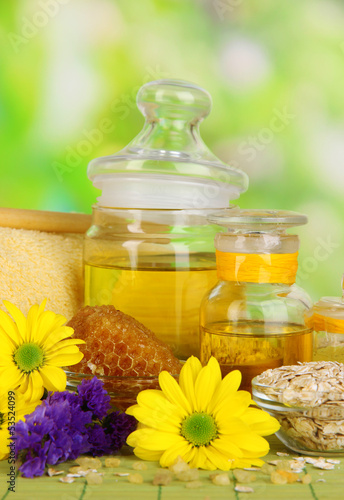 Fototapeta do kuchni Fragrant honey spa with oils and honey on wooden table close-up