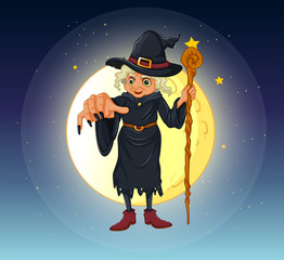 Poster - A witch holding a stick standing at the center of a full moon