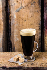 Poster - Black coffee in a Latte Glass and sugar