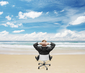 businnessman sitting on beach