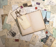 Old Postcards And Open Book. Nostalgic Vintage Background