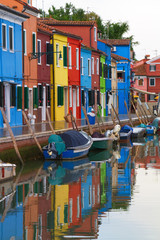 Wall Mural - Row of colourful houses along a canal in Burano.