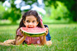 © spass - Cute hispanic girl eating watermelon