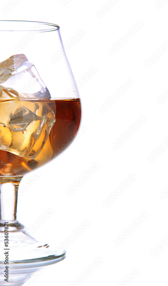 Brandy glass with ice isolated on white