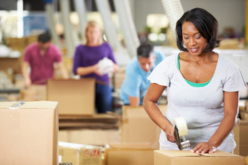 Wall Mural - Workers In Warehouse Preparing Goods For Dispatch