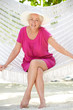 © Monkey Business - Senior Woman Relaxing In Beach Hammock