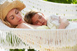 © Monkey Business - Mother And Daughter Relaxing In Beach Hammock