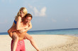 © Monkey Business - Couple Having Fun On Tropical Beach Holiday