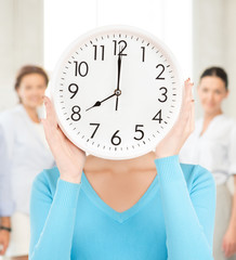 Wall Mural - businesswoman with clock over her face