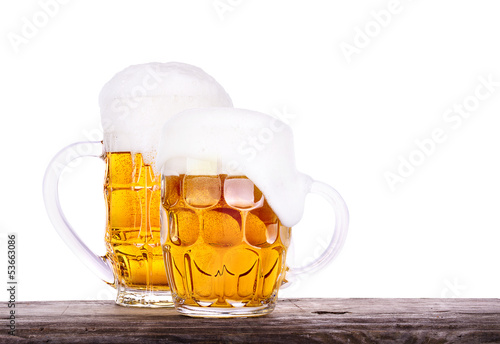 Naklejka na szafę Beer glass on wooden table background